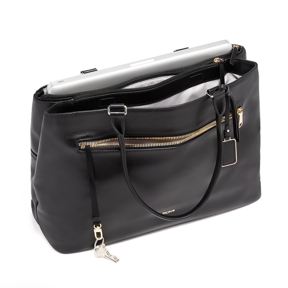 Tumi Sidney Business Tote. Black Genuine leather, like new small wear on bottom.